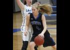 LPGE’s Emma Liebsch drove through the lane during Tuesday’s game against Minnewaska. The junior finished with nine points in the game.