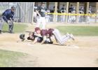 Ted Stacey slid into home plate on a wild pitch to score the first run of the game during LPGE’s game against Royalton.